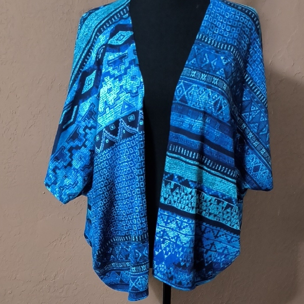 Teal Geometric Kimono by Front of Closet